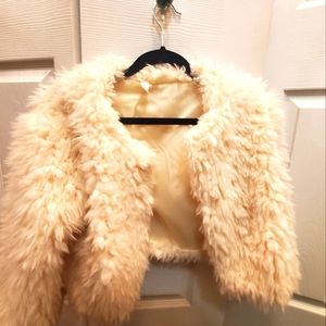 Cream cropped sweater. Great additional layer for an elegant night out.